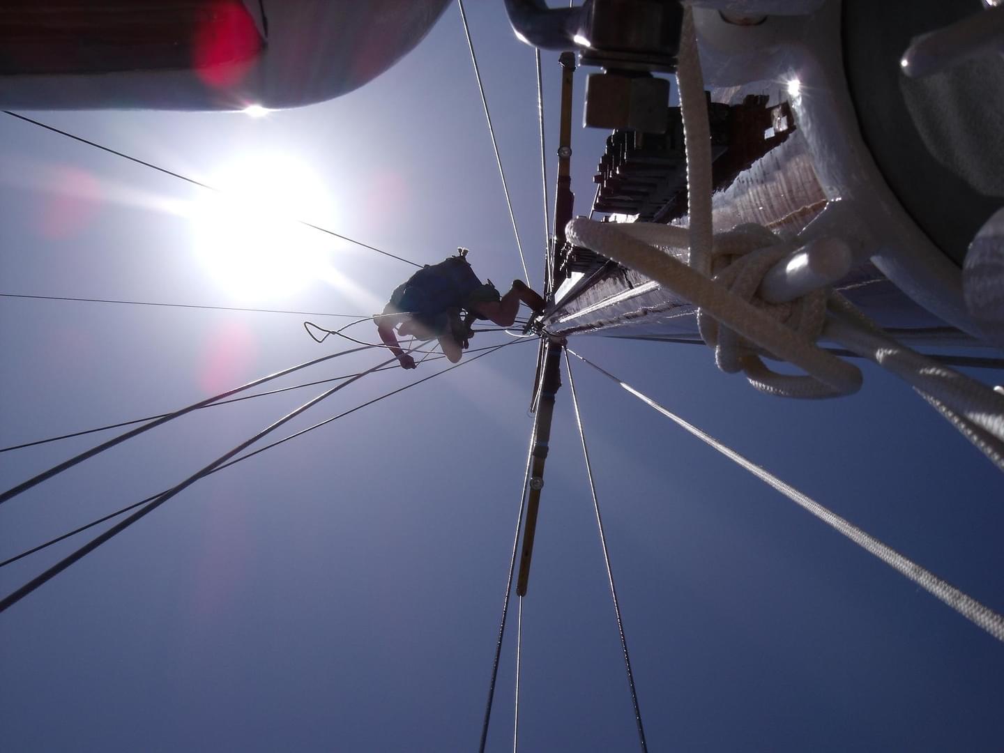 Rigging specialists working on a mast